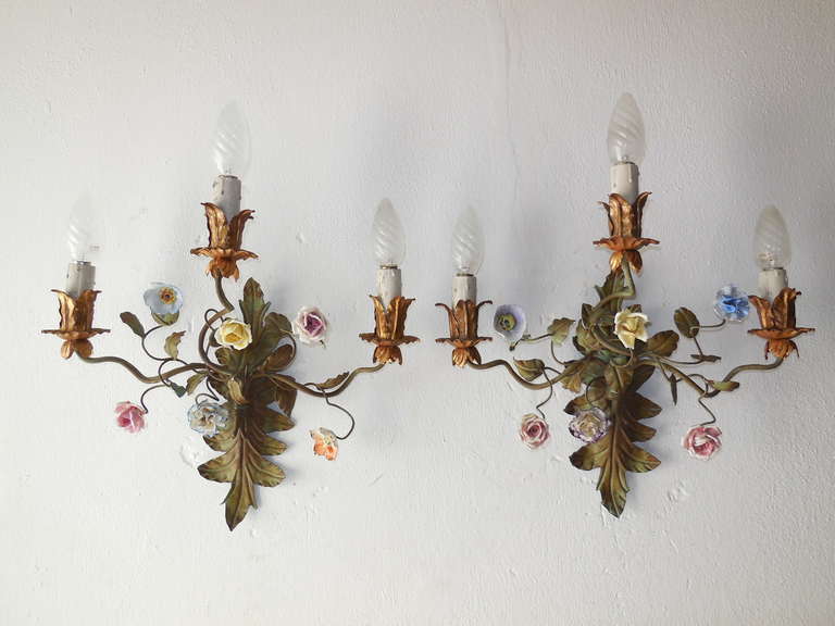 Housing 3 lights each, bulb holders are in wood.   Hand cut tole, porcelain flowers.  Found in Northern Italy. Matching chandelier on, as well.  Re-wired and ready to hang!  Free priority shipping from Italy.