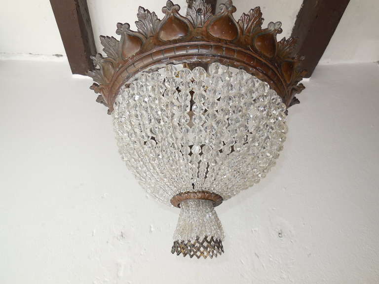 Housing 3 lights.  Heavy cast detailed bronze.  Graduated crystal balls.  Small opalescent beads on bottom which double as a beaded bulb cover. Re-wired and ready to hang!  Free priority shipping from Italy.