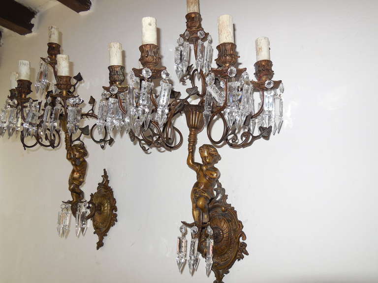 Four Cast Bronze Cherub Crystal Sconces