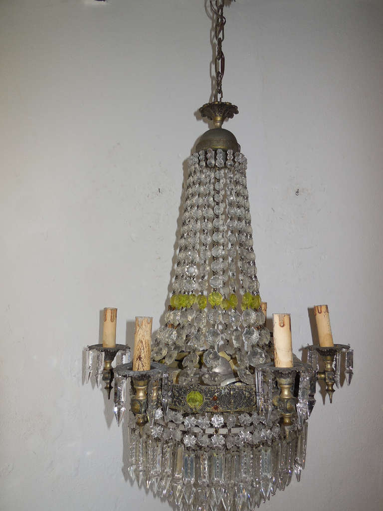 Housing six lights, bulb holders in wood. Detailed bronze with small cherubs and dragons. Seven tier of spear crystals with extremely are star prisms on top of each.  Also adorning rare yellow crystals. Adding 11