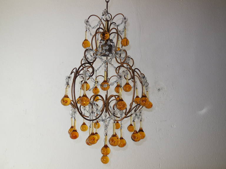 Housing one light from top. Gold gilt metal with macaroni swags throughout. Adorning Murano Yellow and Amber drops. All in great shape. Adding another 10