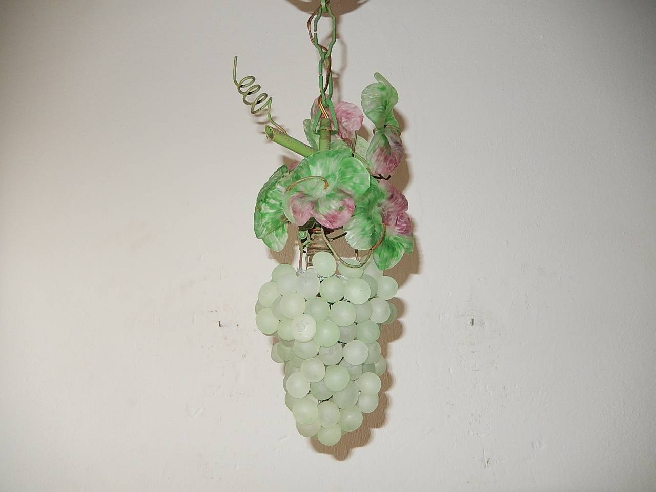 Housing 1 light.  Light green Murano glass in shapes of grapes and leaves.  Leaves are two toned.  Rare find.  Adding another 5 inches of original chain and canopy.  Free priority shipping from Italy.  Re-wired and ready to hang.