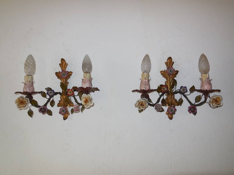 Housing two lights each. Original color on tole. Rare original pink on bulb holders. Handmade porcelain flowers, all in great shape. Re-wired and ready to hang!  Free priority shipping from Italy.