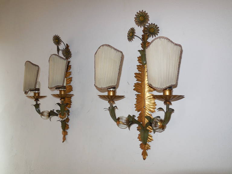 Housing two lights each, bulb holders are in wood. Original gold tole with green leaves.  Rare ribbed glass balls on arms. An excellent example of Maison Bagues craftsmanship. Re-wired and ready to hang!  Free priority shipping from Italy.