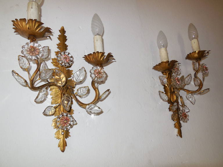 Housing two lights each.  Bulb holders in wood. Original gold gilt tole.  Adorning three crystal flowers and crystal leaves. An amazing example of French craftsmanship. Re-wired and ready to hang!  Free priority shipping from Italy.