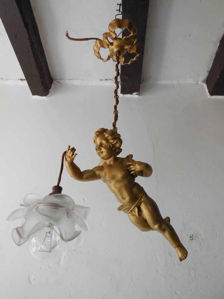 Housing 1 light with floral glass shade.  Heavy bronze, rare chains and top.  Winged cherub and sash with great detailing.  Incredible bronze bow canopy as well. Re-wired and ready to hang!  Free priority shipping from Italy.