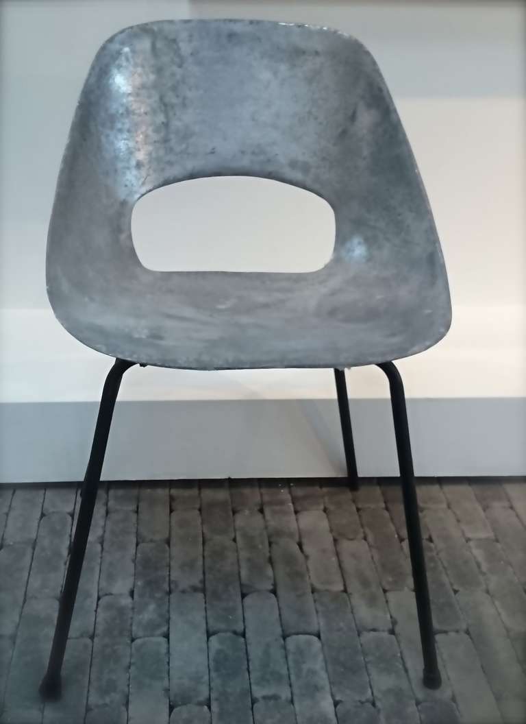 These cast aluminium chairs have a very industrial appearance. They are robust and glamorous at the same time.

Available are 3 of these Tonneau chairs designed by Pierre Guariche in 1954 for Steiner Meubles, Paris.