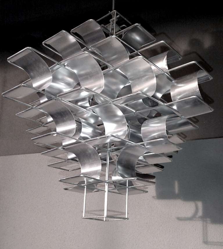 Fantastic pendant designed by Max Sauze for the Max Sauze studio in 1970. 
A wired frame holds many aluminium bent strips creating an atomic structure. This makes up for a fantastic light effect when switched on and even without as the sun plays