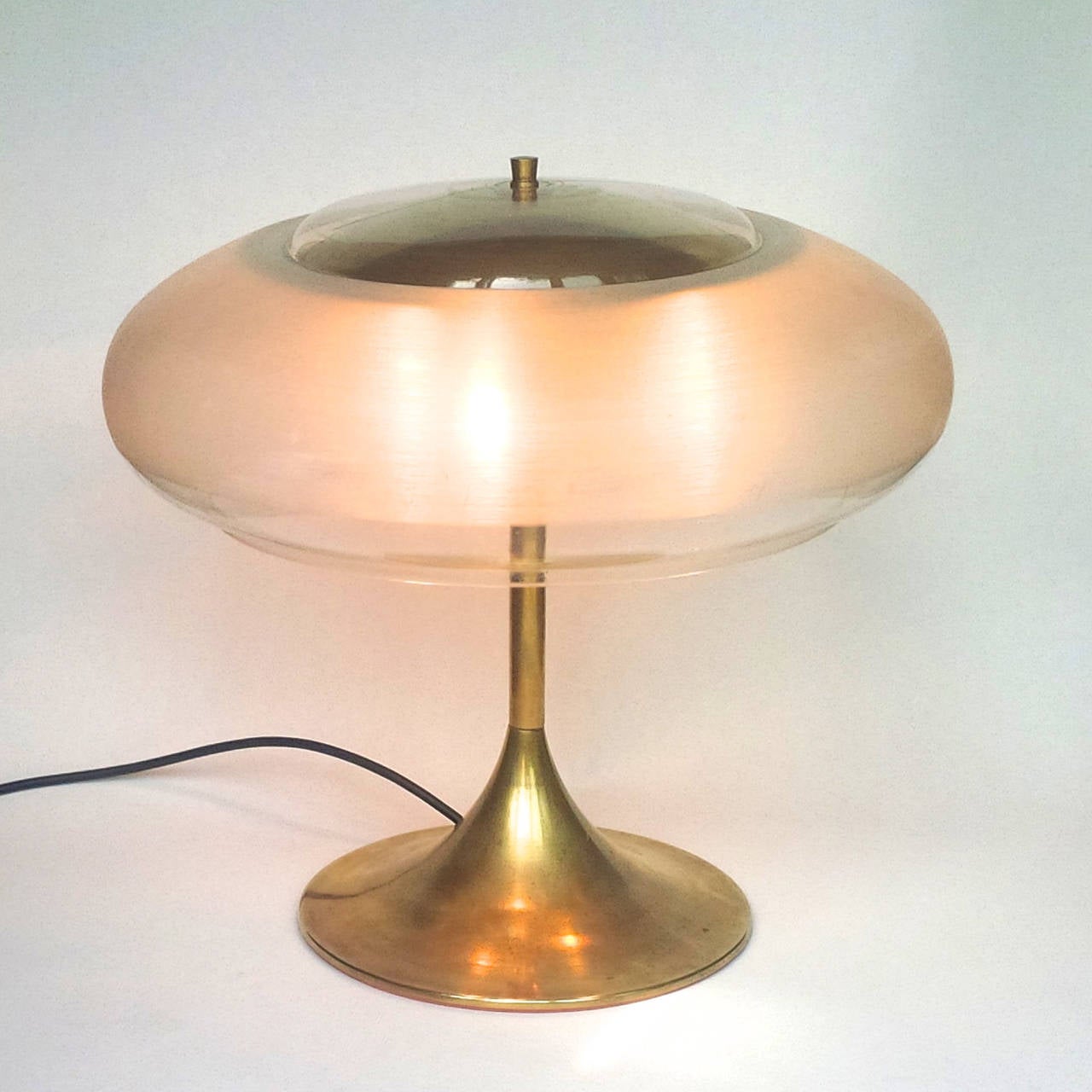 Important table lamp with Lucite shade and brass foot and top with three fittings.