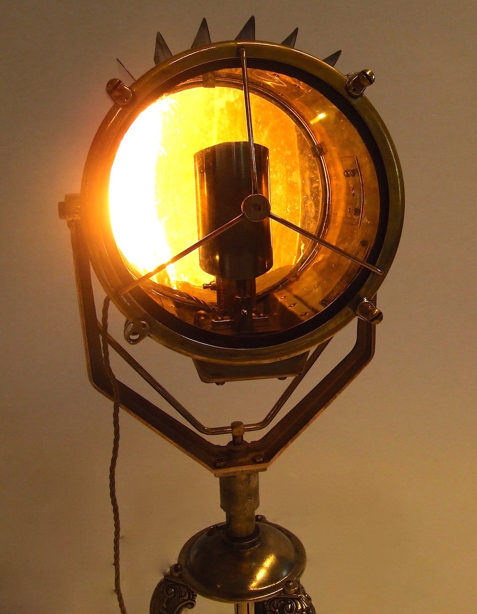 This elegant Francis searchlight was found in an antique shop.
It has done its service on European seas.
The lamp is made from brass entirely with bronze details, All gently polished and sits on a bronze Art Deco table tripod.
The lamp is