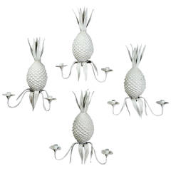 A Set of Four Mid-Century Tole Pineapple Wall Lights