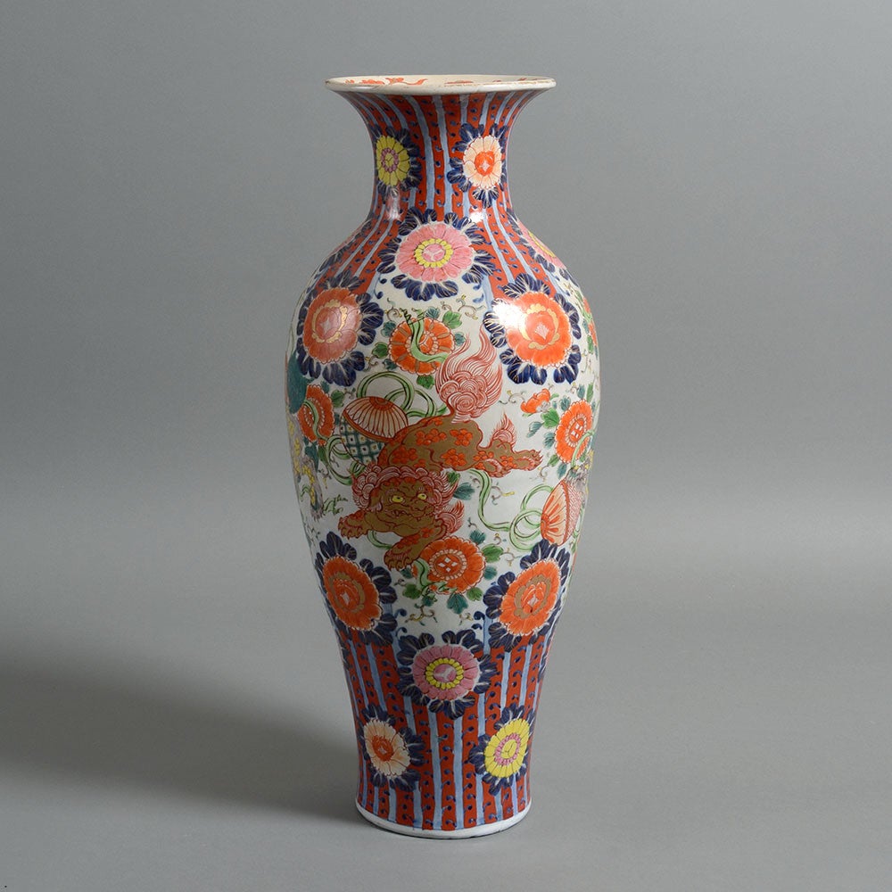A late 19th century Imari vase of large scale and decorated throughout in polychrome glazes, the central area depicting dragons dancing amid flower heads.

(restored) 

By the middle of the 19th century, the Japanese once again began exporting