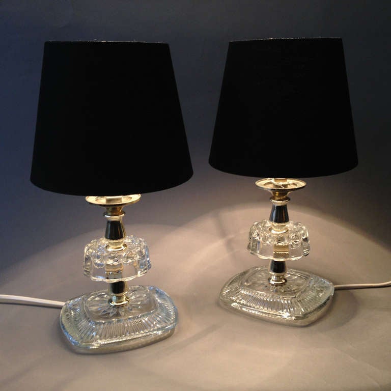 A mid-20th Century pair of glass table lamps of small scale. For a console table or bedside lighting