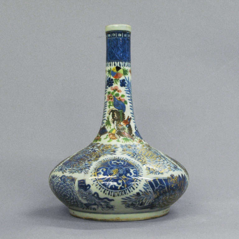 An early 19th century bottle vase with clobbered decoration throughout.