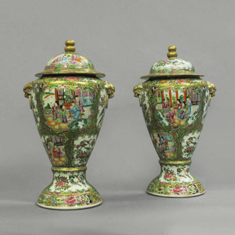 A pair of nineteenth century Canton vases with covers