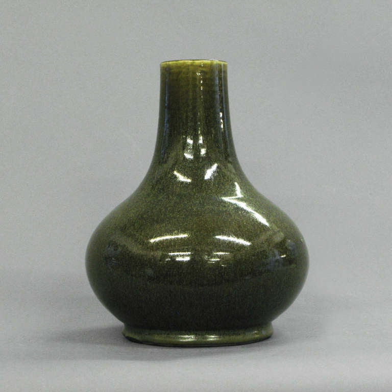 A nineteenth century tea dust glaze bottle vase of gourd form