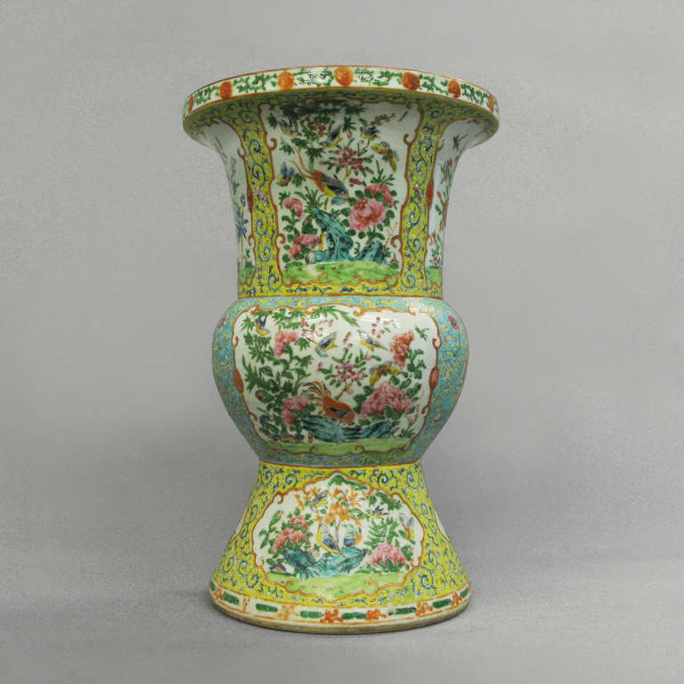 A famille rose beaker vase of good scale decorated throughout with floral vignettes and birds of paradise
