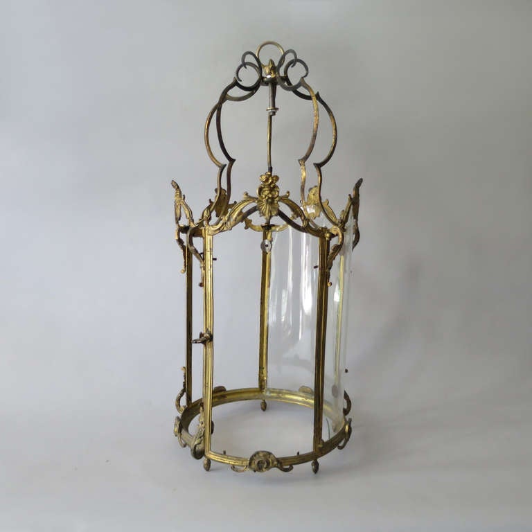 A nineteenth century gilt brass hall lantern in the Louis XV taste having a Rococo frame.

Retaining one pane of glass.