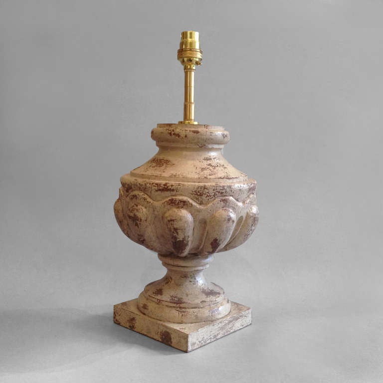 A single carved, painted finial lamp base, of vase form, the turned body with gadrooning and set upon a turned socle and terminating upon a square plinth.

The Château de Brézé dates from the 11th century and is one of the Loire valley's