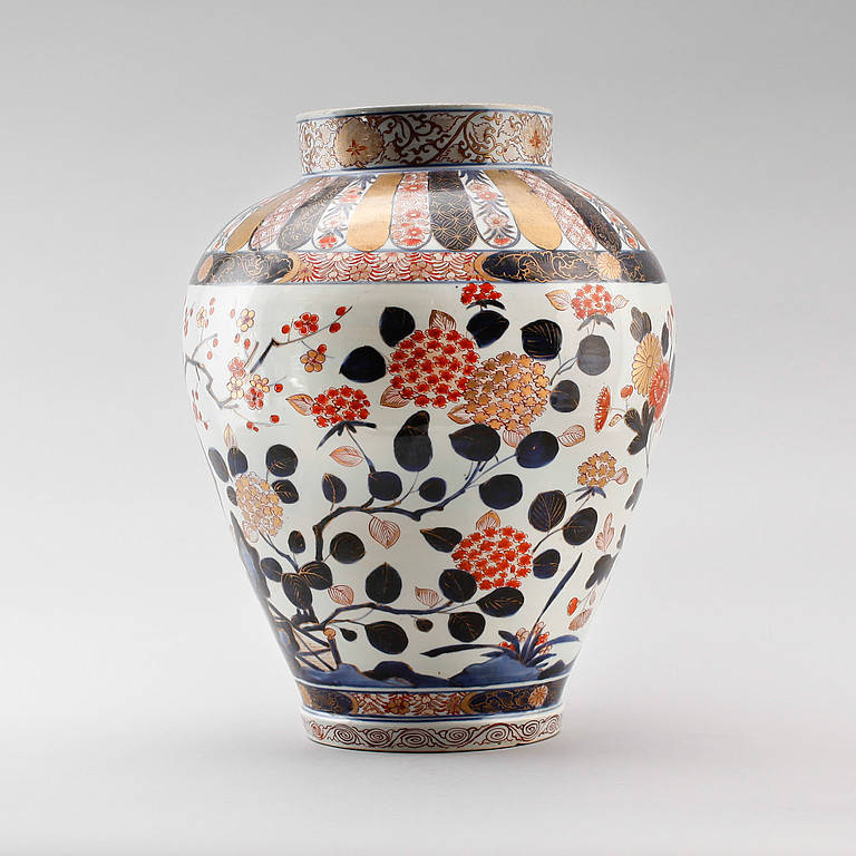 A fine late 17th century Imari vase of good scale, the fine stylized floral decoration in red, blue and gold glazes upon a white ground.

This vase is a good example of Imari porcelain, produced at the end of the 17th century for the European