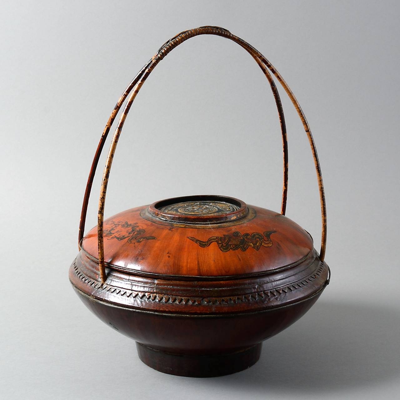 A late 19th century painted elm picnic basket with double looped bamboo carrying handle