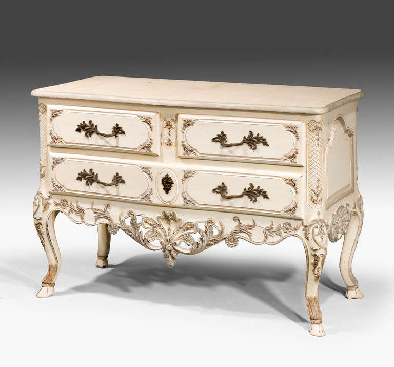 A French white and shaded commode of early 18th century design, on cabriole supports, late 20th century.