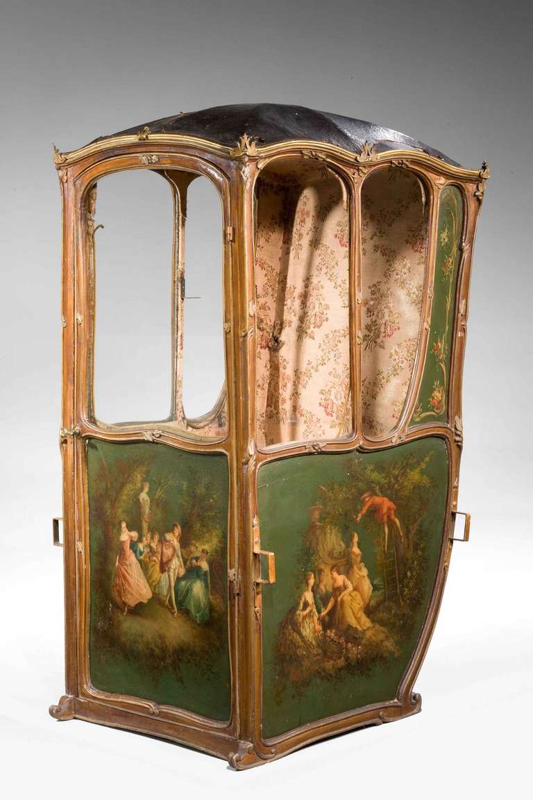 Mid-19th century French sedan chair, the panels finely painted with romantic scenes in the manner of Boucher. The overall frame of finely chiseled gilt bronze edging and mounts now oxidized.

Provenance: Sedan chairs, in use until the 19th