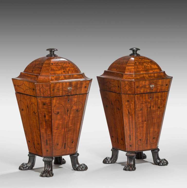 A very fine pair of Regency period mahogany knife boxes, the lids rising on a ratchet, retaining original fittings and plated escutcheon plate. Finely carved paw feet and overall excellent condition.