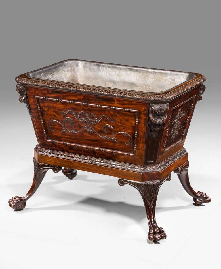 A Fine Large 19th Century Irish Mahogany Wine Cooler incorporating complex detailed carving with canted corners and retaining the original lead liner
