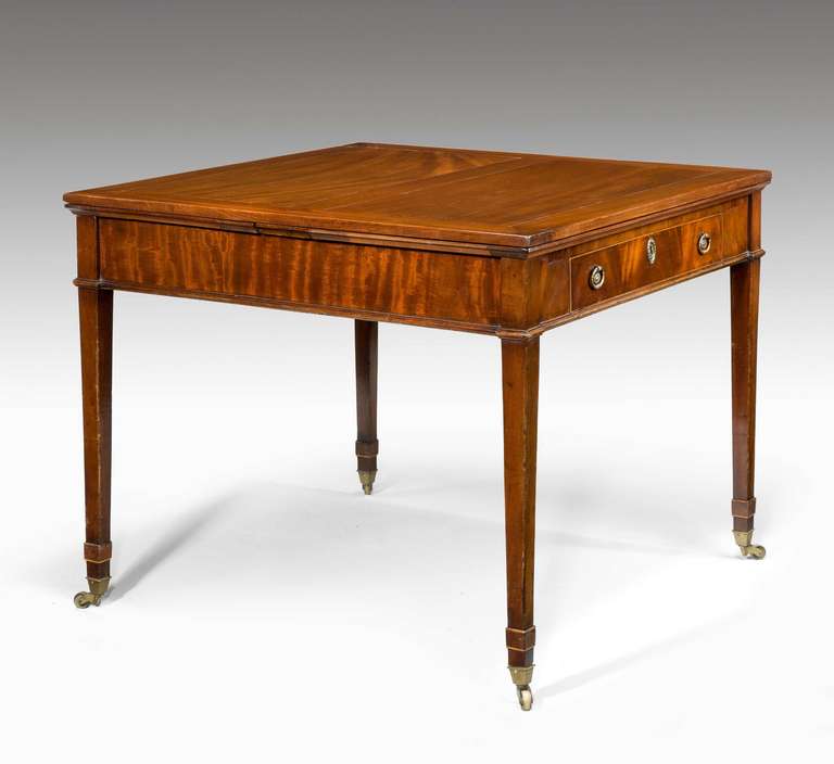 George III period ‘universal’ extending table, exceptionally well designed mahogany table of good proportions when closed, when open capable of seating up to six persons. Has a fitted drawer with pen slide and writing surface.

