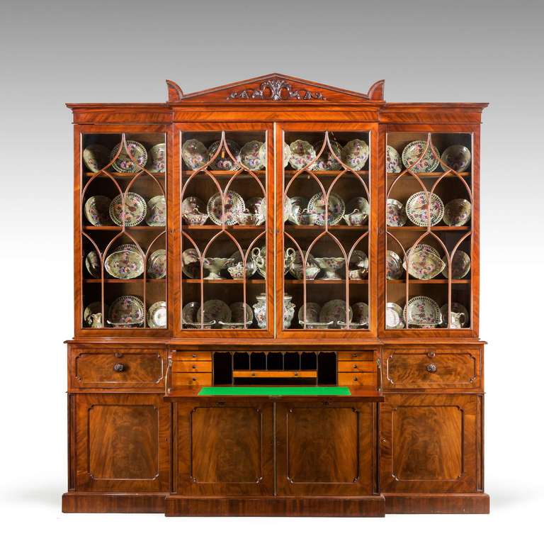 Attributed to Gillows of Lancaster. An exceptionally fine quality Regency period mahogany library breakfront secretaire bookcase, the timbers and overall construction of the highest order. The doors and stiles quartered the interior of the