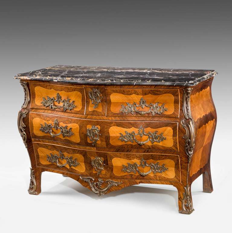 Late 19th Century Kingwood Bombe Commode with good gilt bronze mounts.