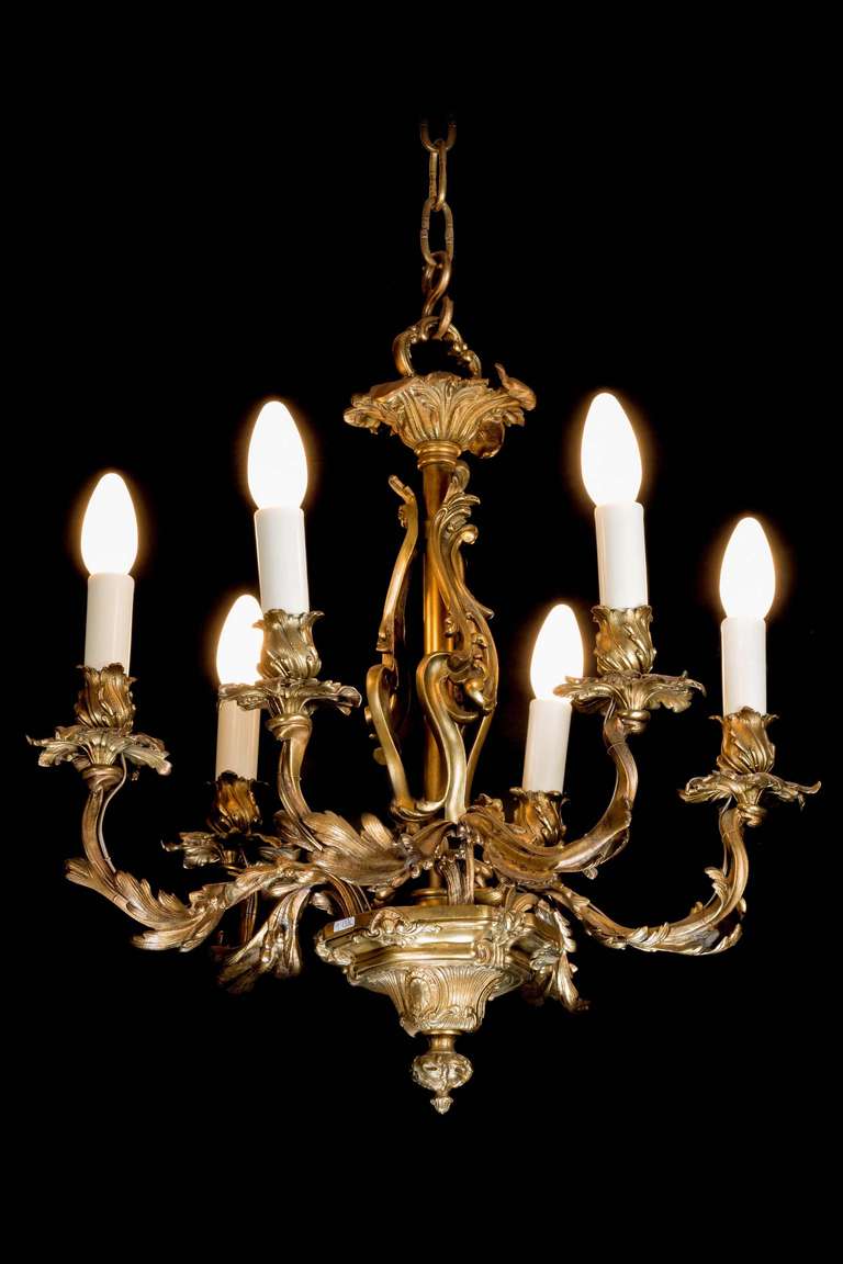 A gilt bronze six-arm chandelier of Rococo form.