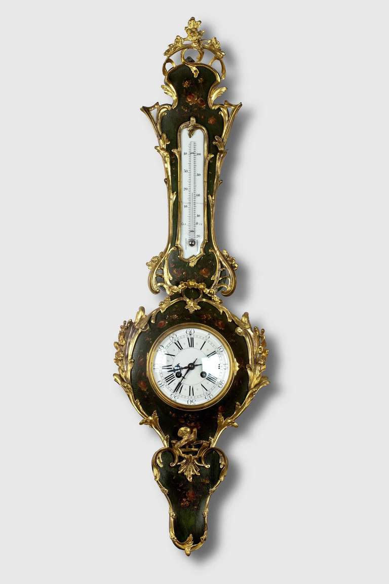 A shapely mid 19th-century clock Barometer with a Vernis Martin main body and delicately painted floral and leaf motifs. The outer edge of Rococo gilt bronze form.

In French interior design, Vernis Martin is a type of Japanning or imitation lacquer