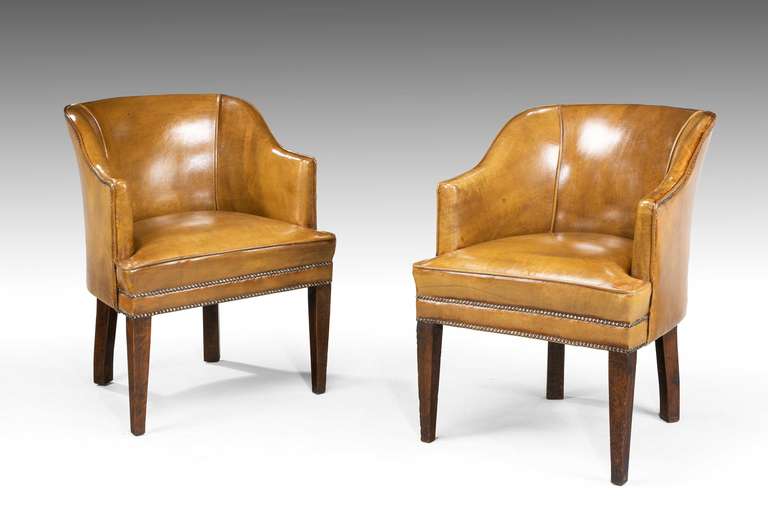 Pair of mahogany framed desk chairs, now covered in the best quality cowhide, square tapering supports, mid-20th century.