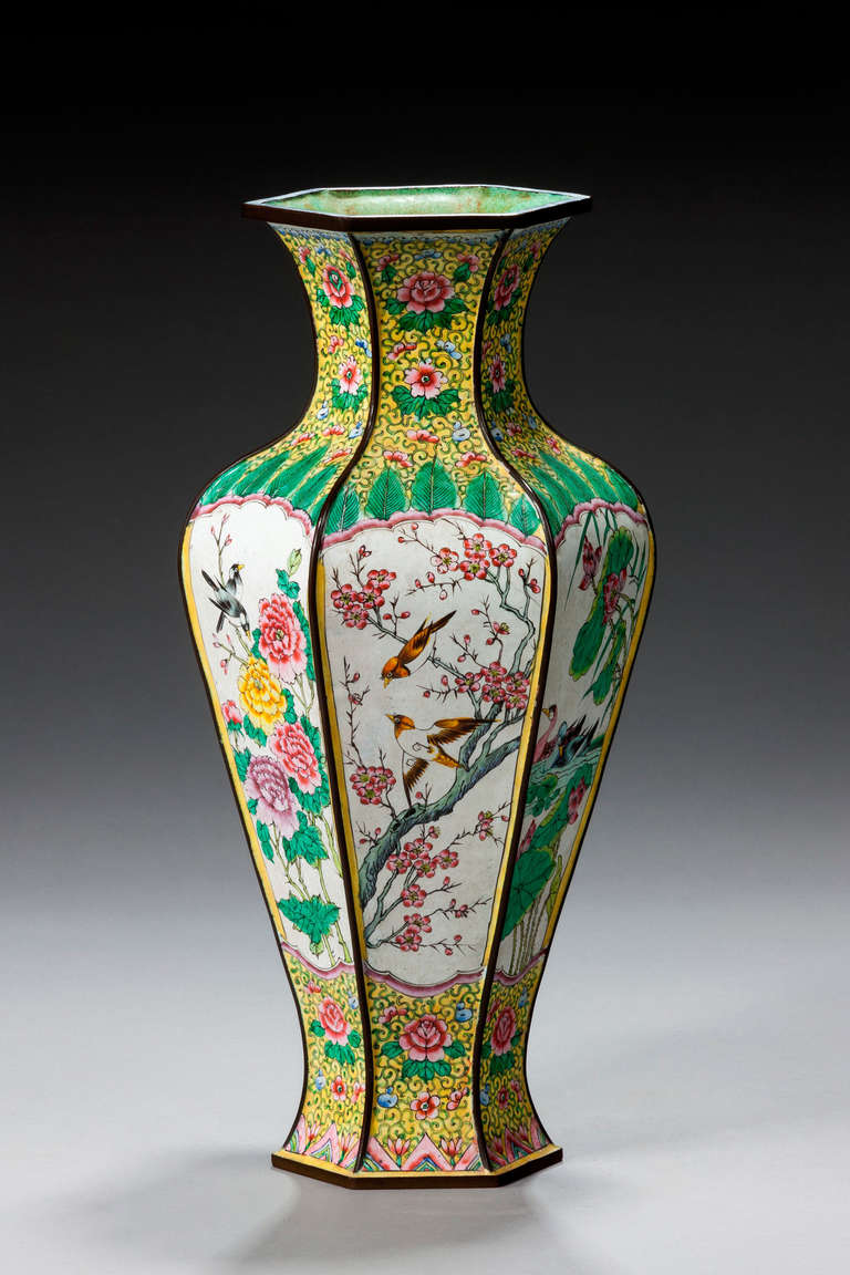 Finely enameled on copper Chinese hexagonal shaped vase with yellow ground decoration, scenes of exotic birds and foliage.