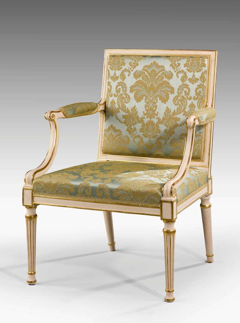 A fine Chippendale period parcel-gilt Elbow chair on turned tapering incised supports.