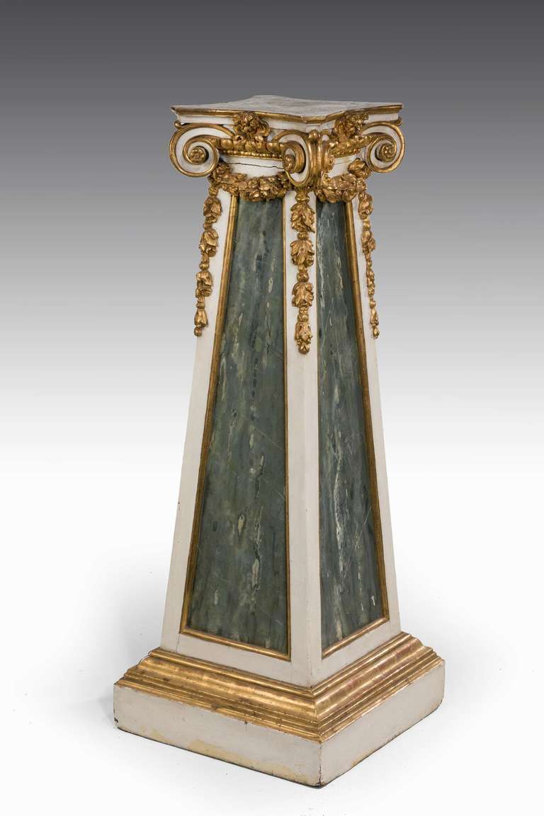 A good mid-19th century tapering parcel-gilt pedestal, the reserve panels with faux marble decoration, original oil gilding now somewhat tried to raised sections.
