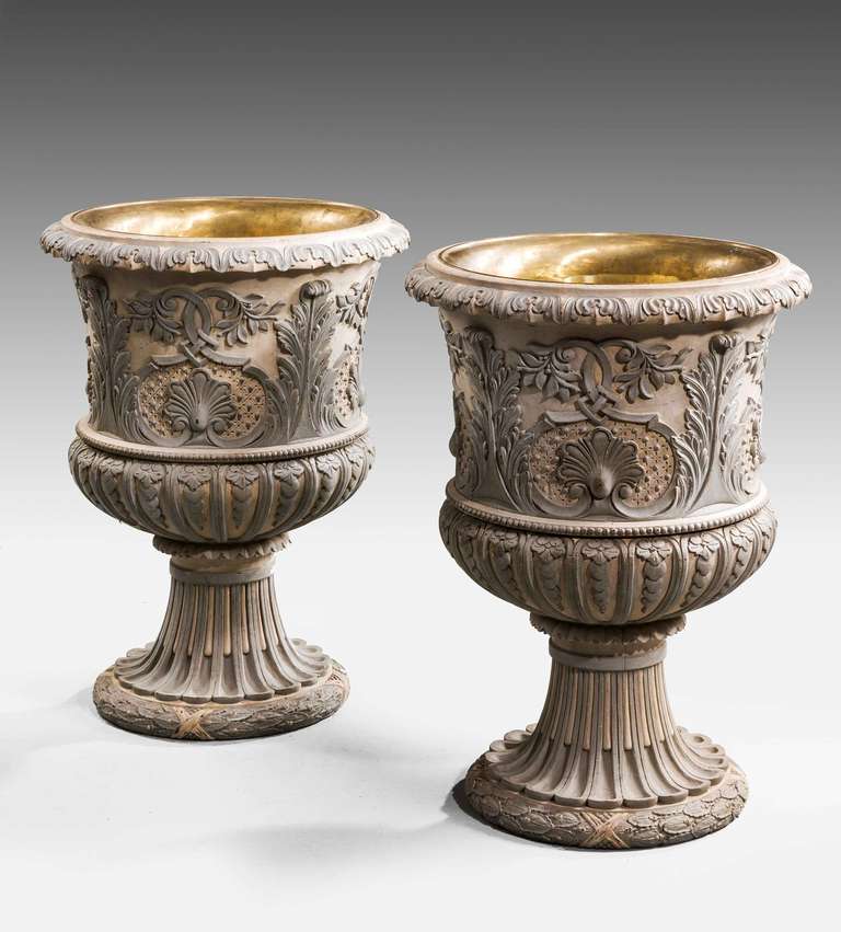 A mid-20th century pair of massive painted carved wood Jardinieres, the finely carved decoration of leafs and foliage with a continuous framework.