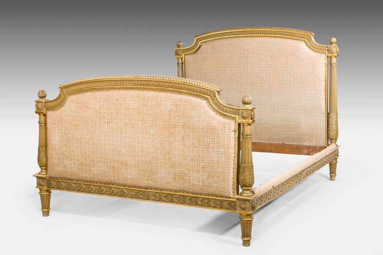 A Fine parcel gilt Bed, with soft original decoration now some what tired. Upholstered upper panel to the top and to the base now requiring recovering.The side pieces well carved with florets dating from the last quarter of the 19th century.