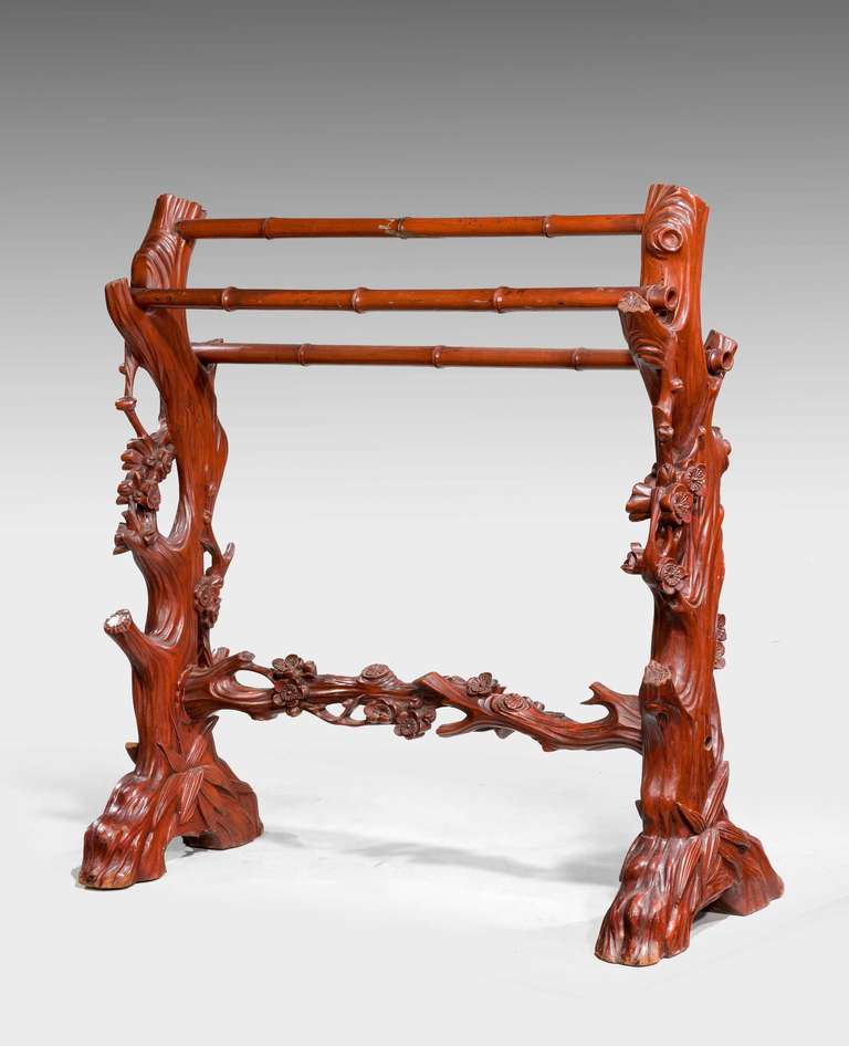 An unusual 19th century carved mahogany towel rail in the form of tree trunks with floral embellishments. Sturdy construction.