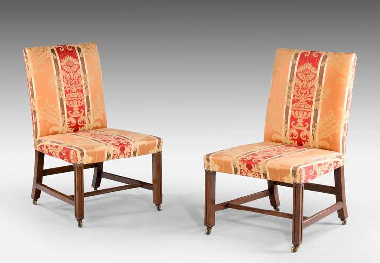 Pair of 18th Century Chippendale period oak Side Chairs, the supports with rectangular incised panels joined by cross stretchers.

RR