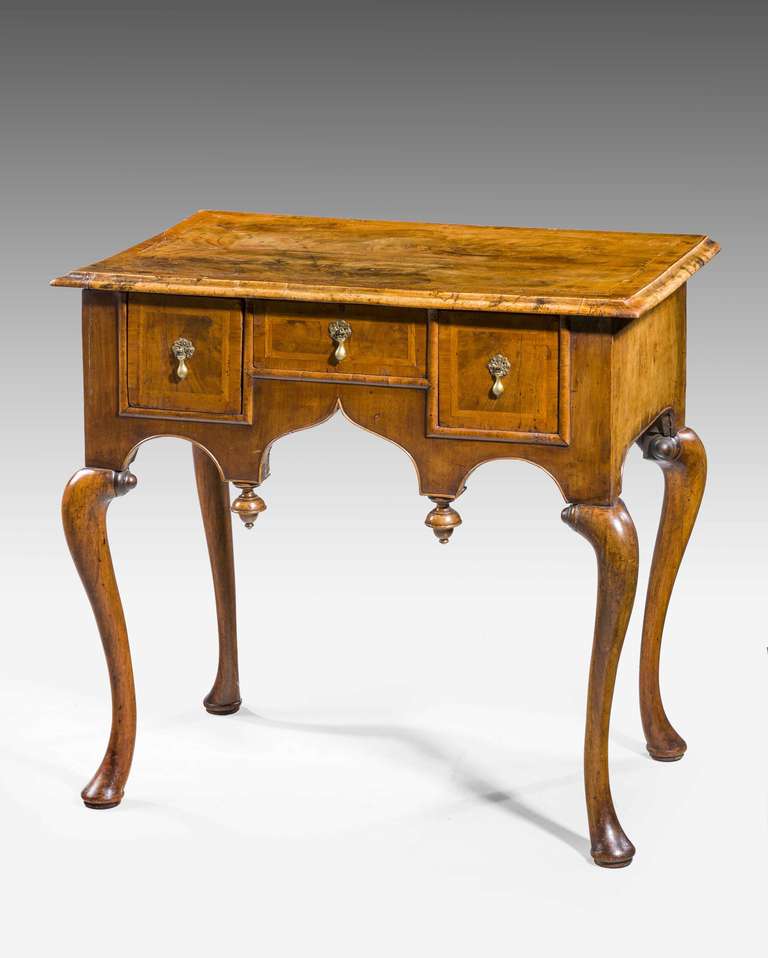 Well designed George I period walnut Lowboy, the top and drawer fronts with herringbone banding, the timbers particularly well figured and very good patina.

RR.