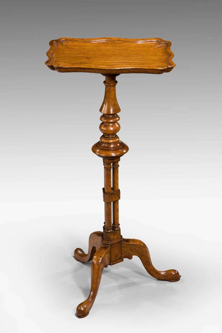 Gillows of Lancaster. An attractive late 19th century oak candle stand, the dished and serpentine top on a well turned central support with cluster column base, the base signed GILLOWS LANCASTER.

Robert Gillow (1704–1772) was an English furniture