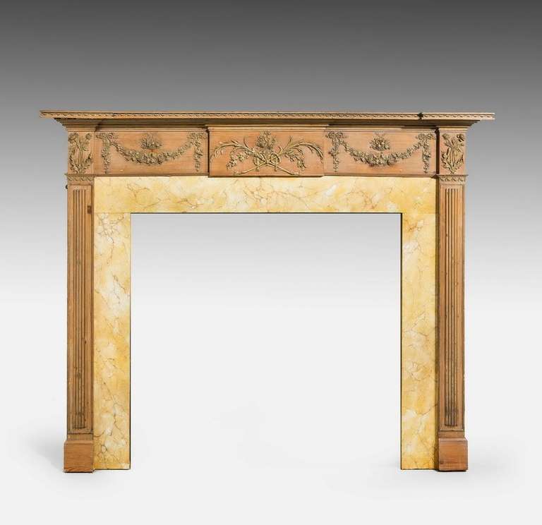 George III period 18th century pine and gesso fire surround, Edinburgh circa 1780-1790, finely executed with wreaths, fruits and leaves.

By the 1800s most new fireplaces were made up of two parts, the surround and the insert. The surround