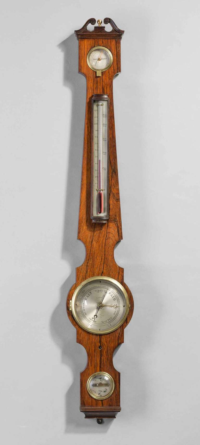 A very fine late Regency period five-inch dial barometer by Francis Amadio of 118 St John Street, London, silvered dial, thermometer, hygrometer, spirit level, having a swan neck pediment with a brass finial.

