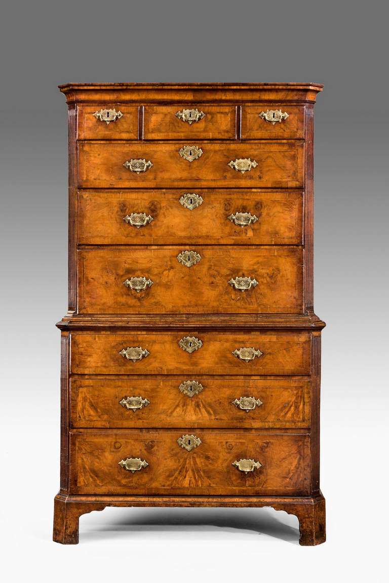 An exceptionally fine George II period figured walnut chest on chest with canted and reeded corners, the beautifully figured timbers within borders of crossbanded and inner herringbone border with a well formed cavetto top.

