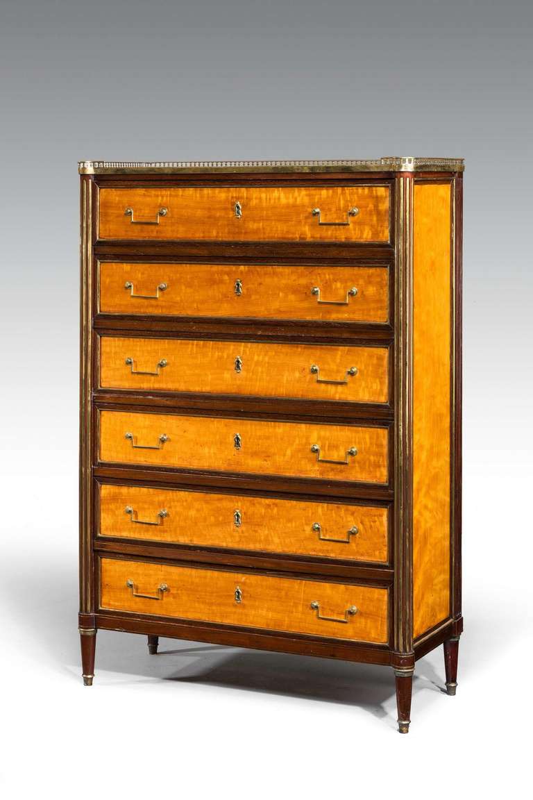 Louis XVI period high chest 'bois de citron' with mahogany banding and stiles with original square section handles and original inset marble top, signed Hermite.

