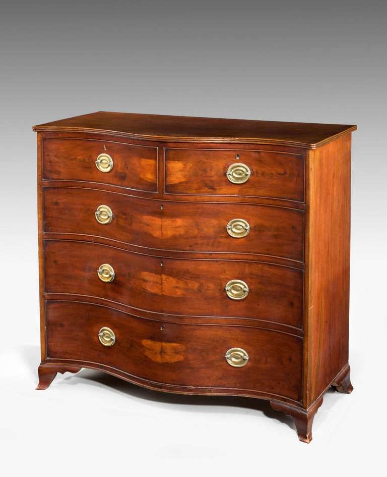 A George III period mahogany serpentine chest, the strongly shaped front with two drawers to the top section and three larger drawers below, top edge readed on finely drawn shaped bracket feet.

