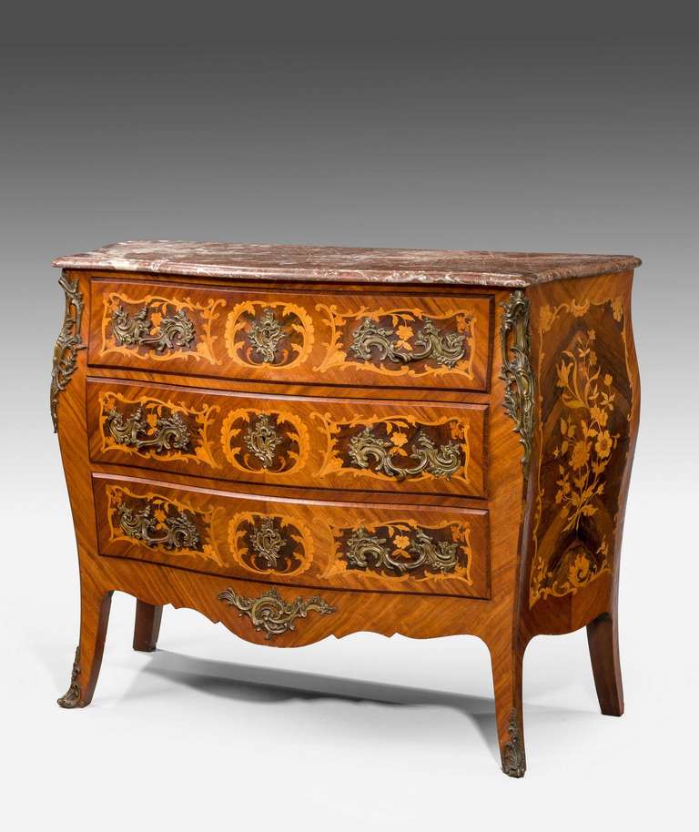 Mid-19th century kingwood marquetry Bombe Commode with well-chosen timbers and with original marble top.

